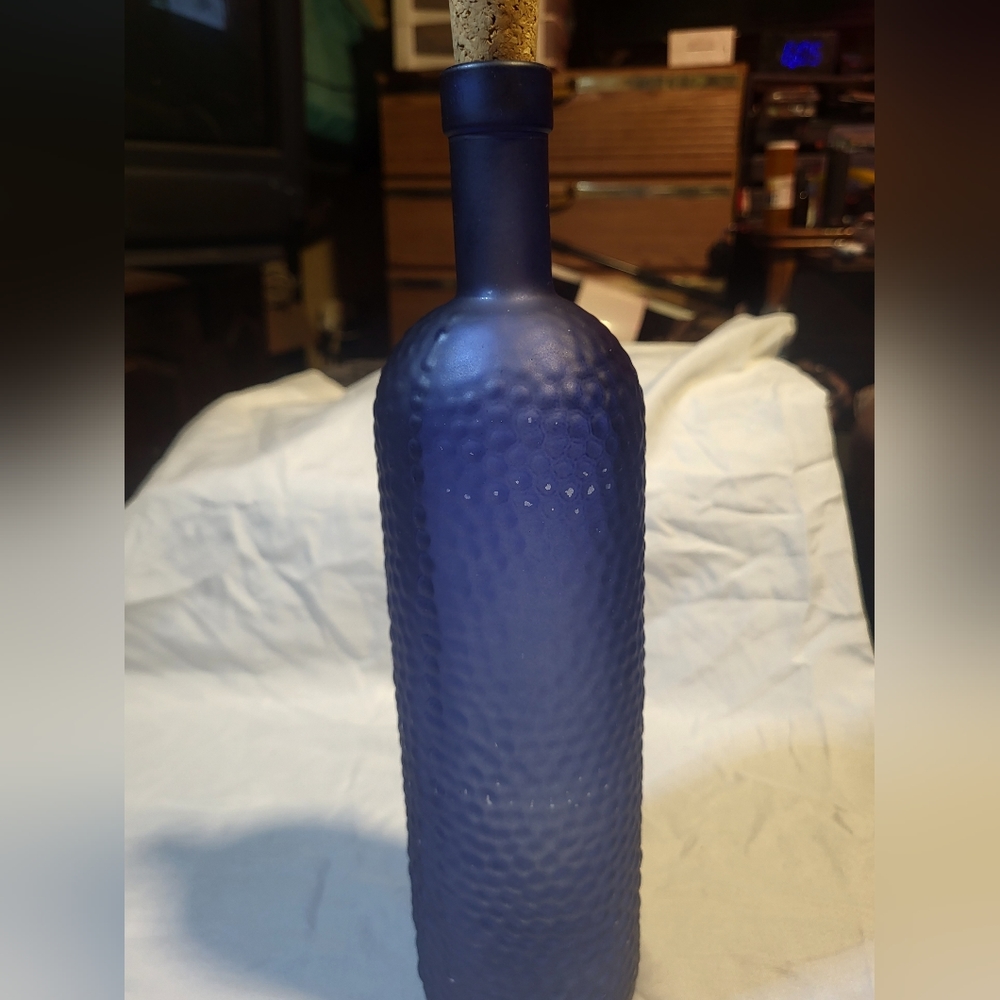 COBOLT BLUE GLASS BOTTLE WITH CORK.